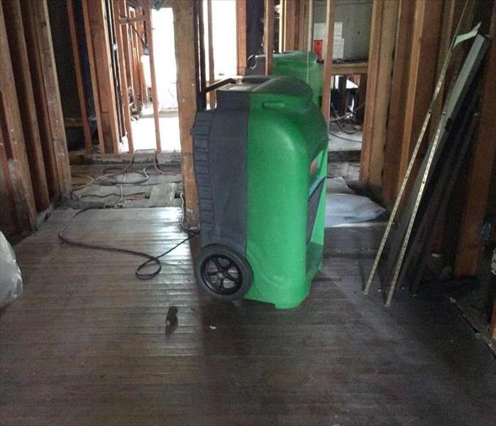 volume of water, a large spill, on a carpet in an office area